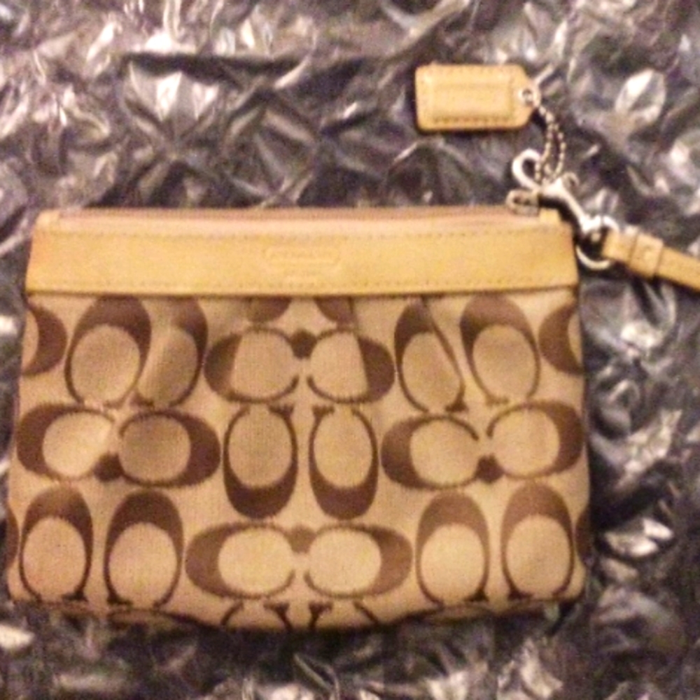 Brown and Tan Coach Wristlet, Authentic. New condition.
